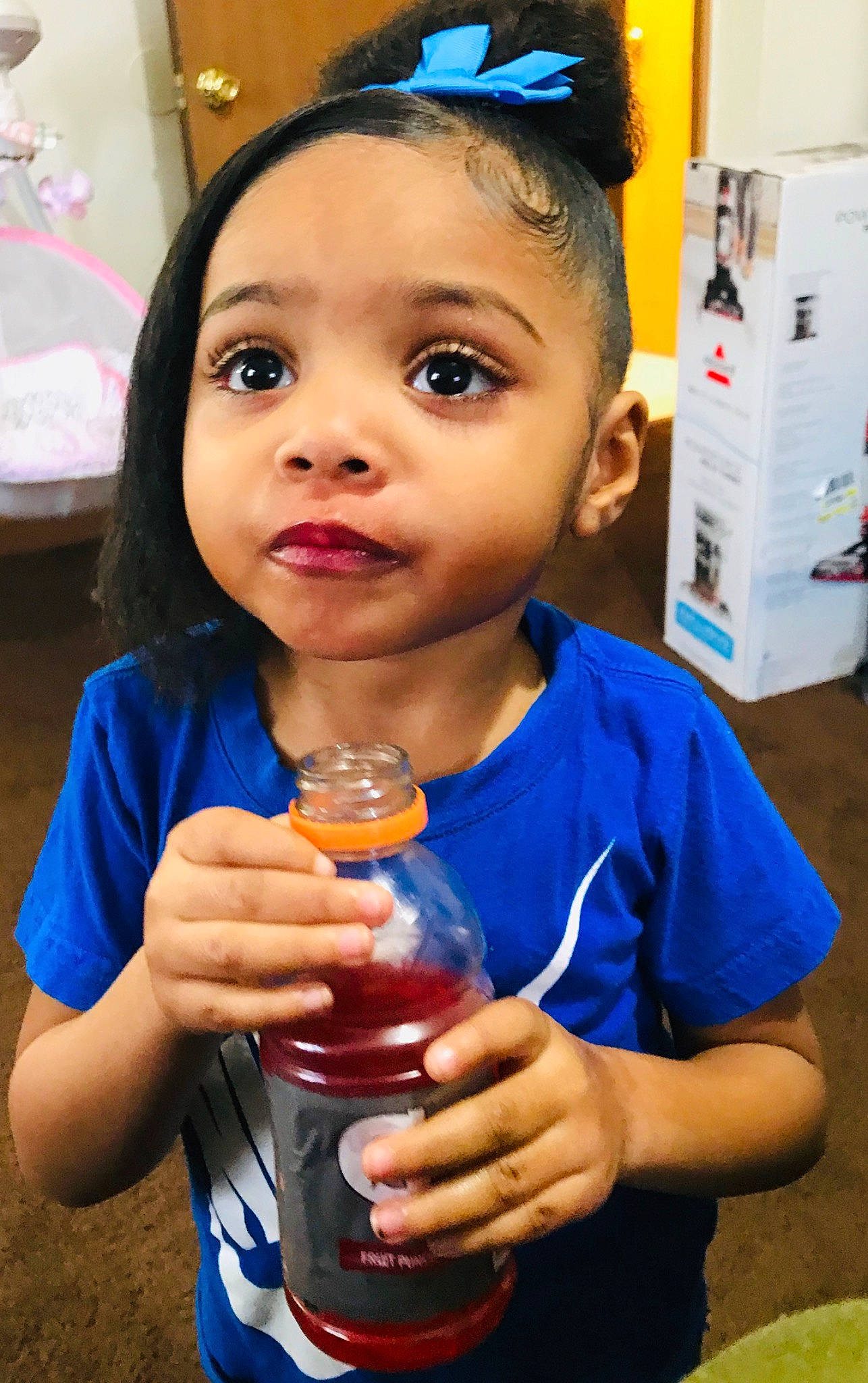 Jayla is registered to the contest to win money with this photo: bottled_water, child, drink, drinking, drinking_water, lip, person, plastic_bottle, smile, toddler, water, water_bottle