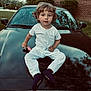 Timmy is registered to the contest to win money with this photo: alloywheel, bodypart, boy, car, carwheel, child, clothing, face, finger, footwear, hand, head, machine, male, pants, person, photography, portrait, shoe, sitting
