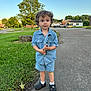 Timmy is registered to the contest to win money with this photo: boy, car, child, clothing, face, footwear, grass, head, jeans, male, pants, person, photography, plant, portrait, shoe, shorts, standing, transportation, vehicle