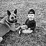 Brantley joined the competition — help win amazing prizes! child, toddler, dog, grass, outdoor, black_and_white, cap, ball, pet, animal, sitting, young_child, canine, nature, casual_clothing, playful, companion, portrait, friendship, relaxing
