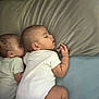 Ahaziah is registered to the contest to win money with this photo: baby, sleeping, infant, bed, pillow, onesie, cuddle, peaceful, nap, child, skin, head, lying_down, indoor, closeup, toddler, sleep, person, soft, comfort