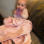 Harper joined the competition — help win amazing prizes! baby, blanket, child, clothing, comfort, couch, cozy, cute, expression, face, home, indoor, infant, person, pink, seated, sofa, soft, teething_toy, young_child