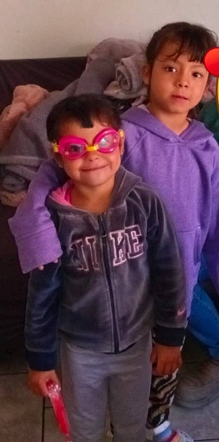 Emily is registered to the contest to win money with this photo: baby_toddler_clothing, cheek, child, cool, event, eye, eyewear, face, fun, happy, head, human, joy, magenta, person, personal_protective_equipment, purple, sleeve, smile, t_shirt