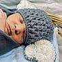 Grayson is registered to the contest to win money with this photo: newborn, baby, sleeping, hat, knitted, grey, white, heart, basket, blanket, cozy, wrapped, infant, peaceful, cute, soft, closeup, portrait, indoors, child