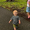 toddler, child, boy, girl, park, outdoor, path, trees, grass, clothing, striped_shirt, denim_skirt, tie_dye, walking, smiling, summer, nature, footwear, casual, daylight