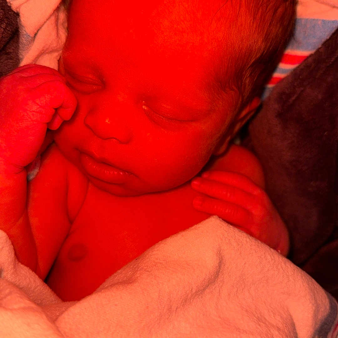 Bakarii is registered to the contest to win money with this photo: baby, blanket, child, closeup, cozy, curly_hair, cute, face, hand, indoors, infant, newborn, peaceful, portrait, resting, skin, sleeping, soft, toddler, wrapped