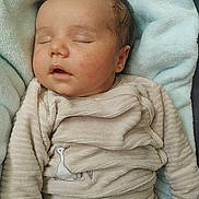 Emilio a rejoint le concours — aidez-le/la à gagner de superbes lots ! baby, sleeping, pajamas, blanket, soft, cozy, infant, cute, peaceful, child, face, hand, clothing, rest, portrait, indoors, nap, young, comfort, relaxation