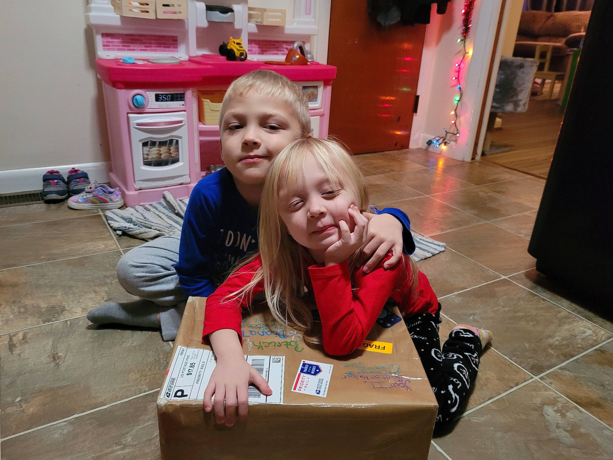 Patrick joined the competition — help win amazing prizes! box, chair, chest_of_drawers, child, cupboard, event, floor, flooring, fun, hardwood, leisure, person, play, room, shipping_box, sitting, smile, toddler, wood