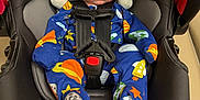 Owen joined the competition — help win amazing prizes! infant, baby, car_seat, safety_1st, sleeping, onesie, space_theme, colorful_clothing, child, strapped_in, head_support, indoor, seatbelt, baby_gear, peaceful, newborn, transportation, nap_time, black, soft_lighting