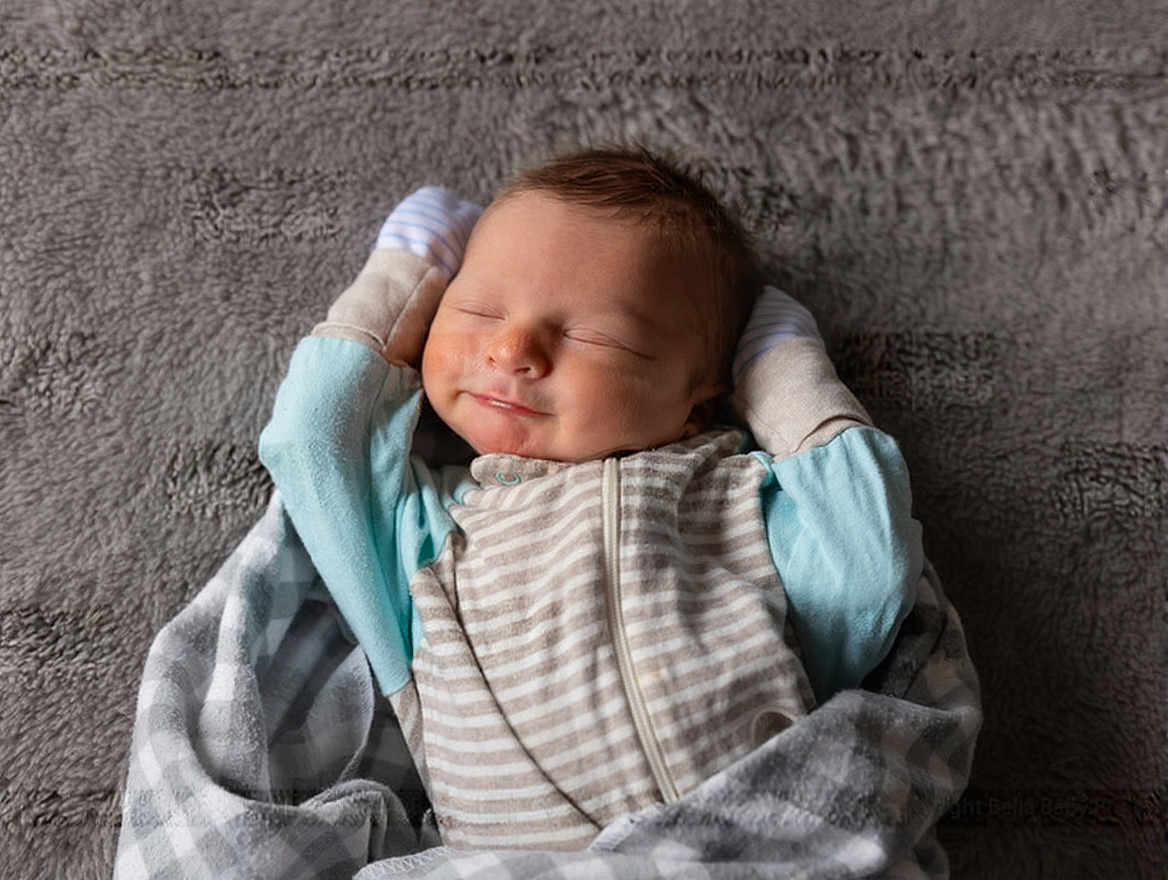 Owen joined the competition — help win amazing prizes! baby, sleeping, blanket, infant, smiling, cozy, soft, cute, child, pajamas, face, peaceful, rest, newborn, comfort, relaxed, clothing, indoors, portrait, warm