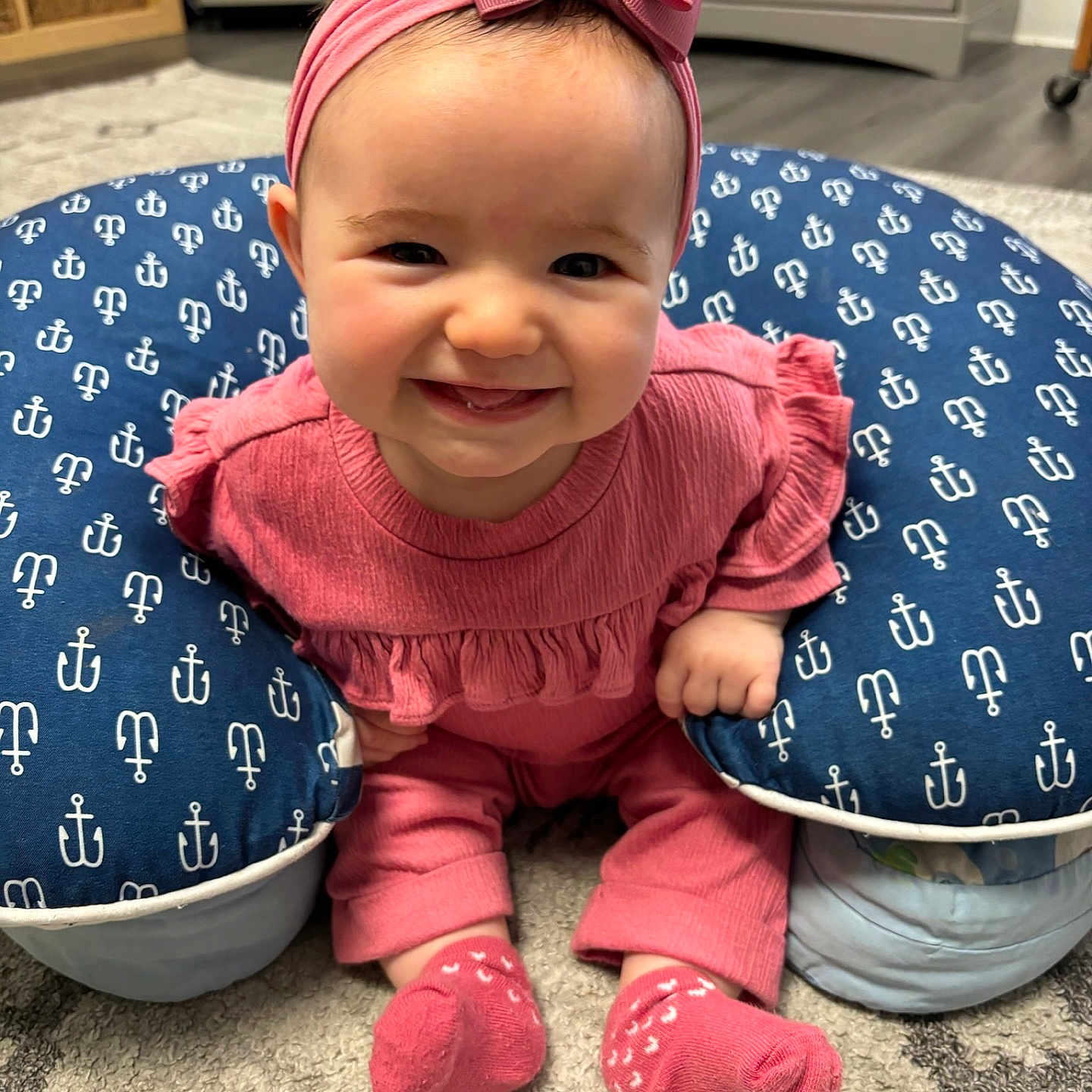 Hunter is registered to the contest to win money with this photo: baby, babylaughing, clothing, cushion, dress, face, furniture, happy, head, homedecor, hosiery, laughing, pants, person, photography, pillow, portrait, sitting, smile, sock