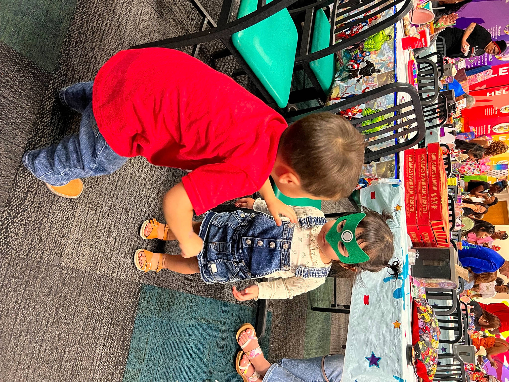 Amelia joined the competition — help win amazing prizes! artist, child, city, collection, customer, flooring, fun, games, headwear, leisure, market, marketplace, orange, person, play, public_space, recreation, retail, t_shirt, toddler