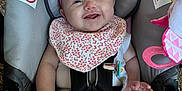 Paisley joined the competition — help win amazing prizes! baby, car_seat, pink_bow, bib, smile, infant, child, seat_belt, pacifier, clothing, toy, happy, cute, headband, indoor, person, baby_accessory, fabric, hand, foot