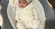Ruby joined the competition — help win amazing prizes! baby, infant, headband, pajamas, baby_rocker, plush_toys, indoor, soft_toys, cute, child, footwear, smiling, face, person, comfort, wood_floor, striped_fabric, white_clothing, seated, relaxed