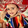 Emmanuel Mendoza is registered to the contest to win money with this photo: toddler, child, smiling, sombrero, colorful_poncho, saluting, happy, face, clothing, indoor, cute, portrait, baby, bright_colors, hat, cheerful, playful, candid, person, celebration