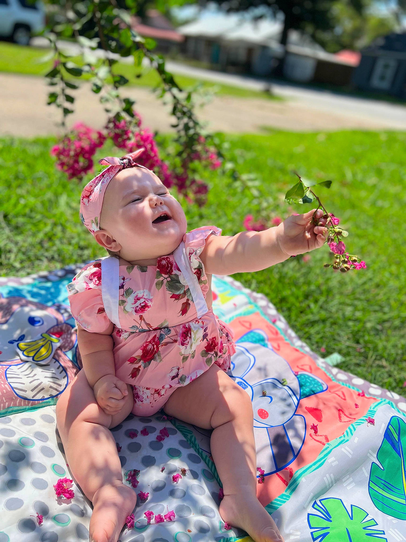 Kinslee is registered to the contest to win money with this photo: baby, baby_toddler_clothing, child, fun, grass, happy, human_leg, leisure, magenta, pattern, people_in_nature, person, pink, plant, recreation, shorts, sitting, summer, thigh, toddler