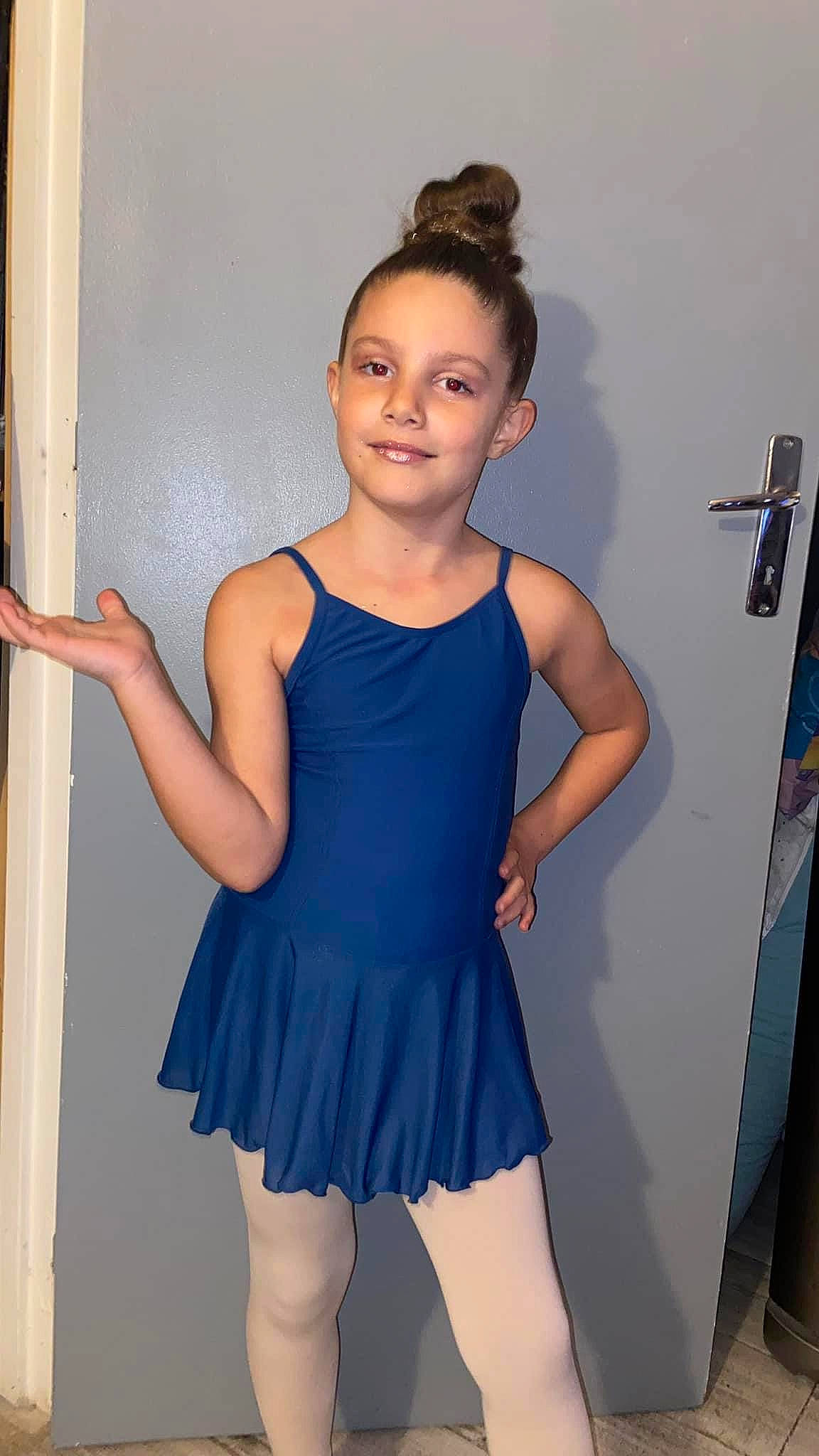 Linsay participe au concours pour gagner de l'argent avec cette photo : baby_toddler_clothing, day_dress, electric_blue, fashion_design, flash_photography, gesture, hairstyle, human_body, human_leg, joint, joy, knee, neck, one_piece_garment, person, shoulder, sleeve, smile, standing, thigh