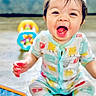 baby, bright, casual, child, colorful, cute, face, floor, happy, indoor, infant, mouth_open, pajamas, person, playtime, sitting, smiling, tablet, toy, young
