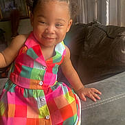 Andrea joined the competition — help win amazing prizes! accessories, blouse, child, clothing, couch, dress, face, female, formalwear, furniture, girl, happy, head, homedecor, laughing, person, photography, portrait, sitting, smile