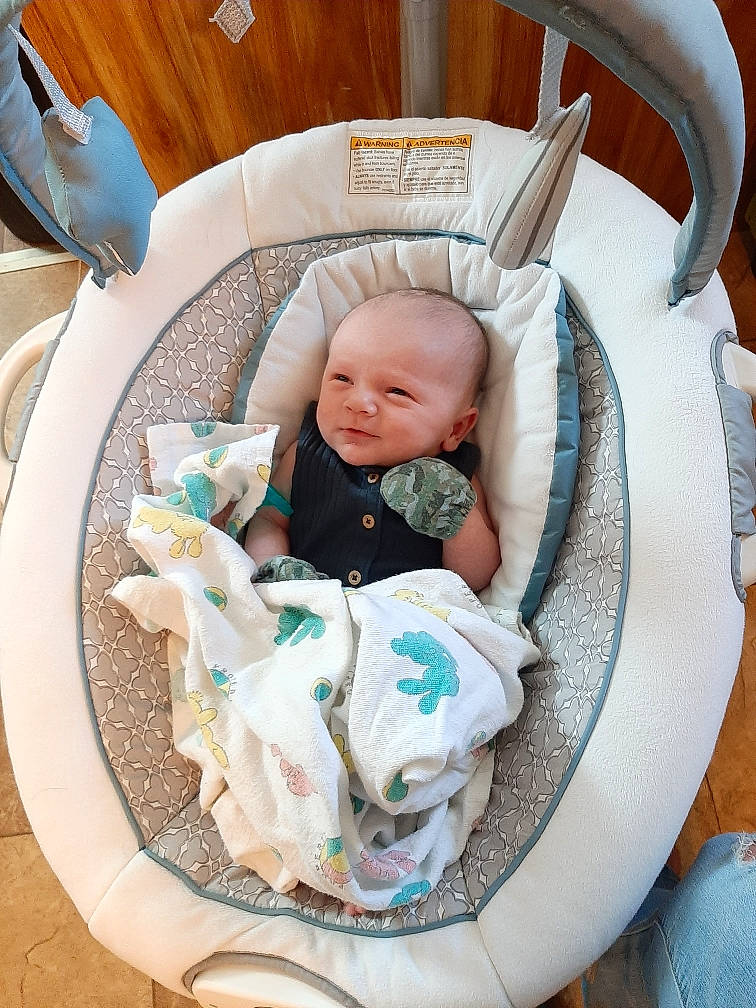 Crew is registered to the contest to win money with this photo: baby, baby_carriage, baby_in_car_seat, baby_products, baby_safety, baby_sleeping, baby_toddler_clothing, chair, child, comfort, infant_bed, linens, person, product, room, sitting, toddler, white