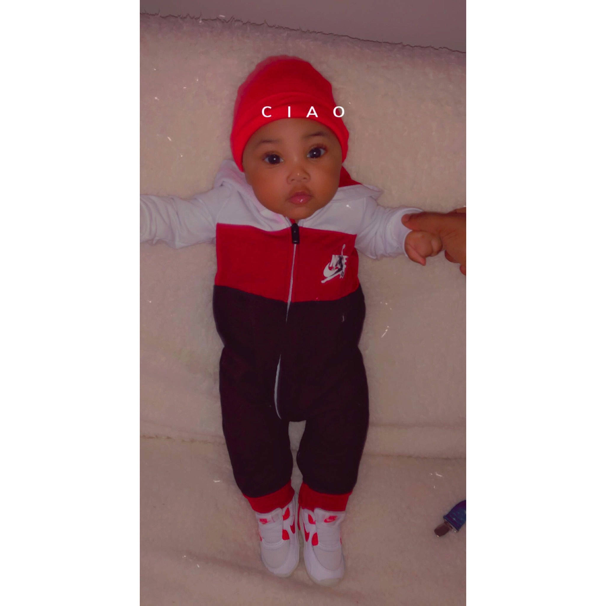 Kyng is registered to the contest to win money with this photo: active_pants, baby, baby_toddler_clothing, cap, carmine, child, costume_hat, electric_blue, flooring, font, happy, headwear, magenta, outerwear, pattern, person, personal_protective_equipment, recreation, sleeve, sportswear