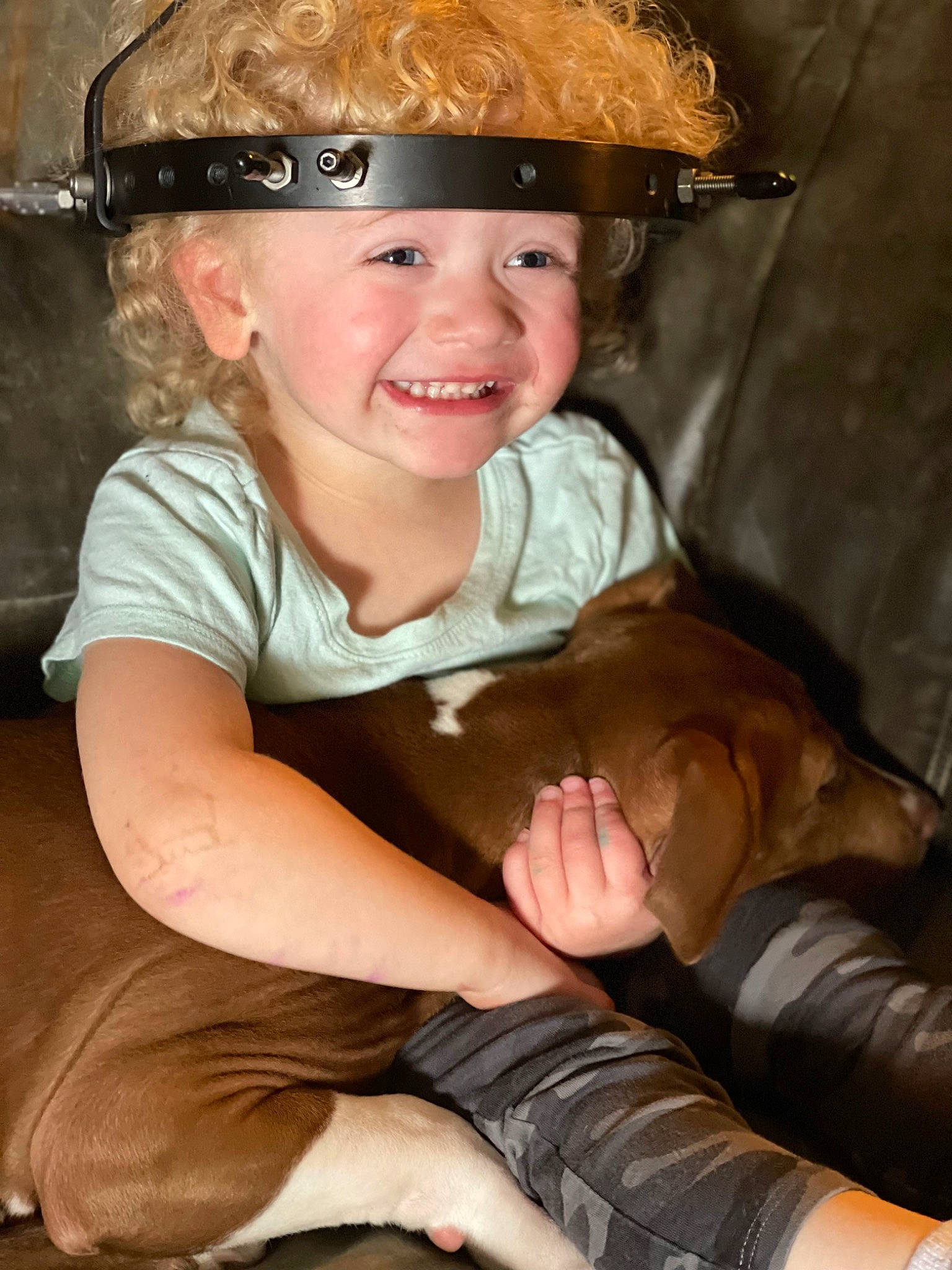 Mackenna is registered to the contest to win money with this photo: arm, cheek, ear, eye, face, facial_expression, finger, flash_photography, gesture, hairstyle, happy, head, headwear, helmet, human_body, iris, joy, mouth, organ, person