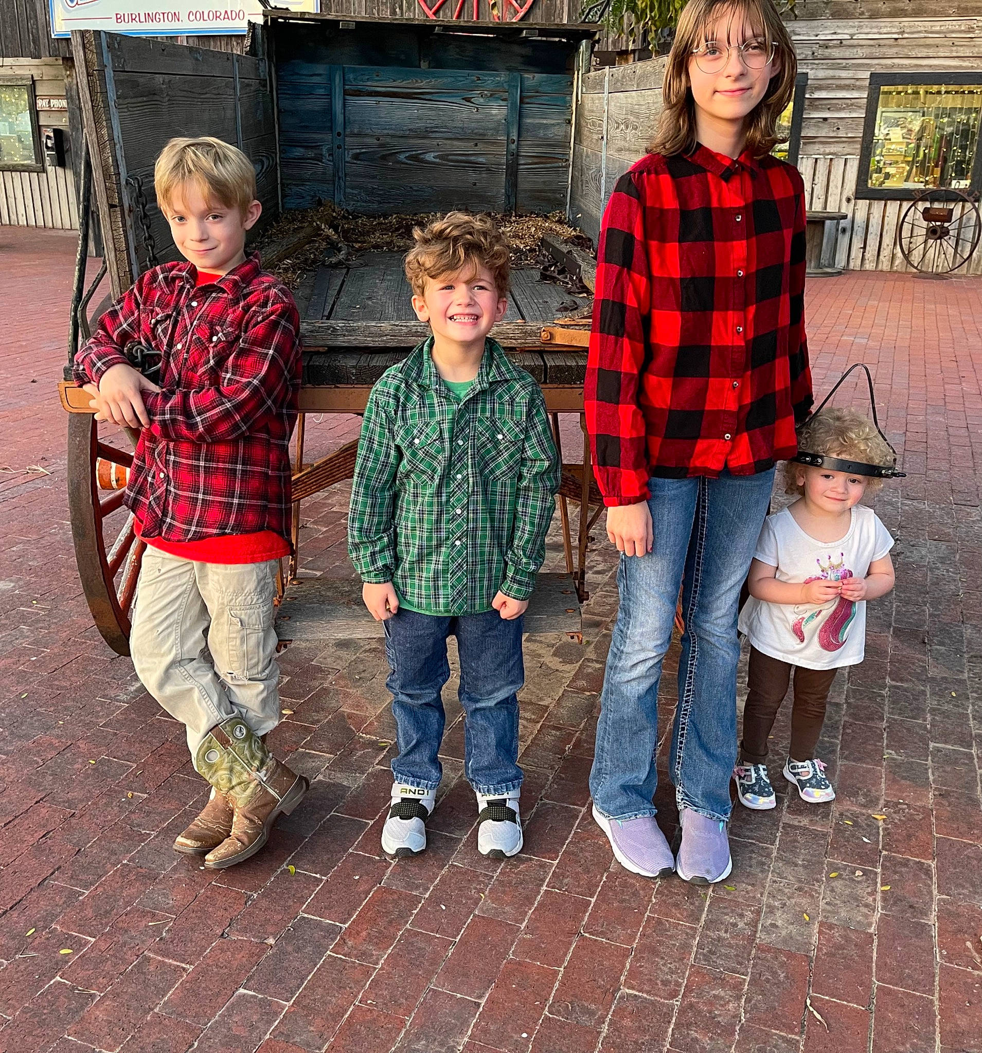 Mackenna joined the competition — help win amazing prizes! cool, denim, face, facial_expression, happy, head, headwear, jeans, joy, leg, leisure, person, plaid, plant, recreation, shoe, sleeve, smile, sneakers, tartan