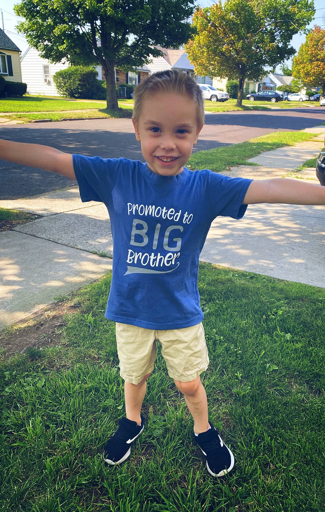 Jaxson is registered to the contest to win money with this photo: baby_toddler_clothing, cool, electric_blue, eye, fun, grass, happy, joy, leisure, people_in_nature, person, plant, recreation, shoulder, sleeve, smile, standing, summer, t_shirt, toddler