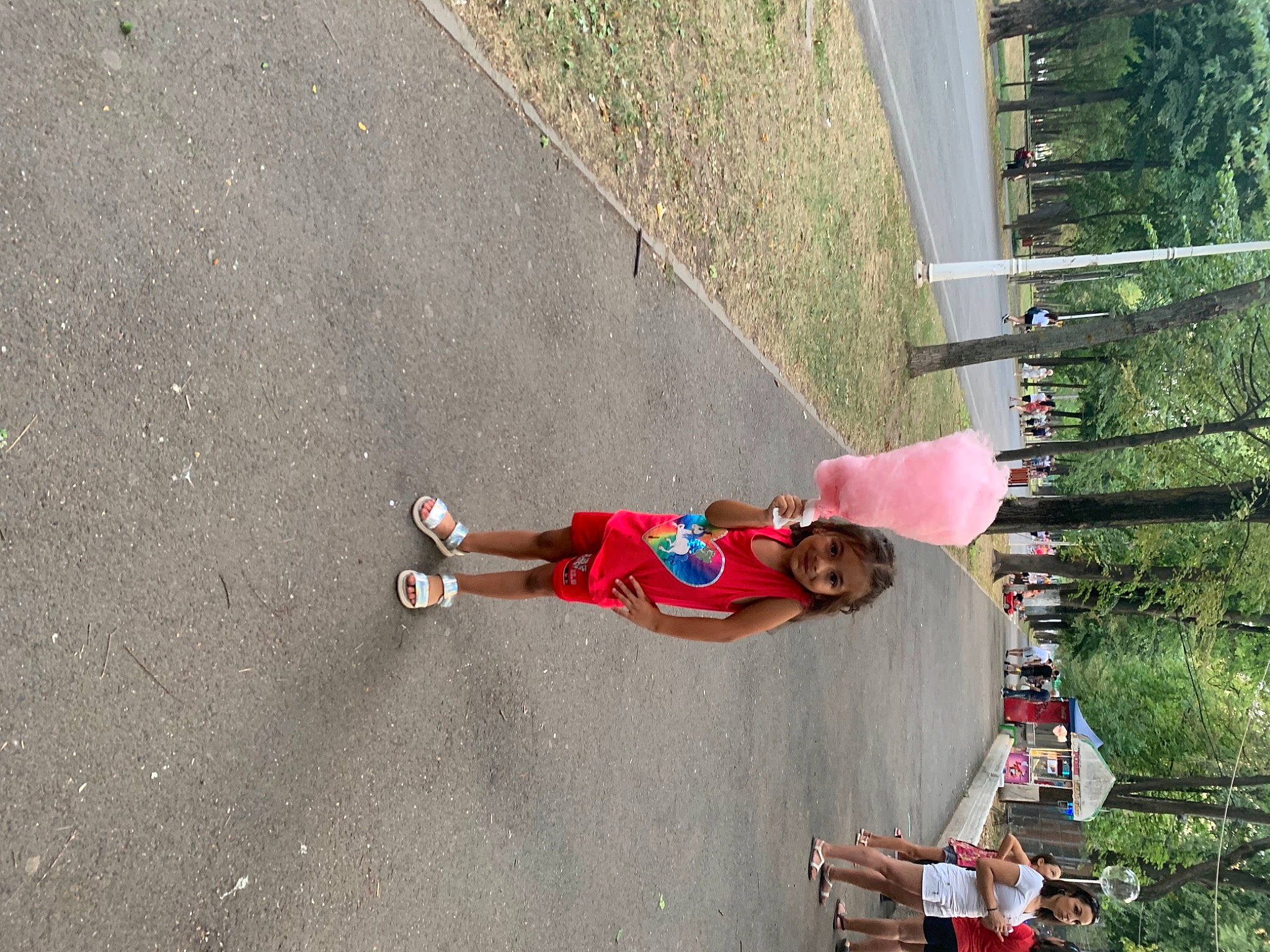 Andreea is registered to the contest to win money with this photo: asphalt, carmine, concrete, fun, joy, leisure, person, plant, recreation, road_surface, shadow, sidewalk, smile, t_shirt, toddler, tree, walking_shoe