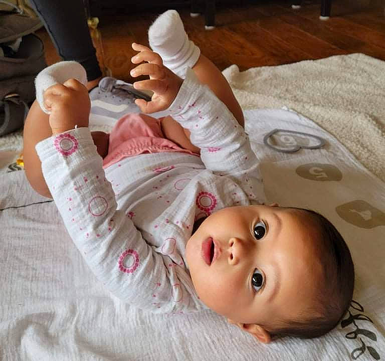 Alexandria joined the competition — help win amazing prizes! baby, baby_toddler_clothing, barefoot, cheek, child, comfort, finger, foot, gesture, hand, human_leg, knee, linens, mouth, nail, person, skin, sleeve, thumb, toddler