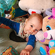 Zélie participe au concours pour gagner de l'argent avec cette photo : accessories, baby, bodypart, couch, cushion, face, finger, furniture, hand, happy, head, homedecor, jewelry, necklace, person, photography, plush, portrait, smile, toy