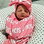 Iris joined the competition — help win amazing prizes! newborn, baby, pink_blanket, bow_hat, sleeping, face, infant, cozy, cushion, star_pattern, wrapped, resting, soft_fabric, indoors, cute, child, person, portrait, headwear, peaceful