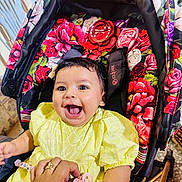 Alma participe au concours pour gagner de l'argent avec cette photo : accessories, baby, babylaughing, clothing, dress, face, flower, happy, head, jewelry, laughing, necklace, person, photography, plant, portrait, rose, smile, stroller, t_shirt