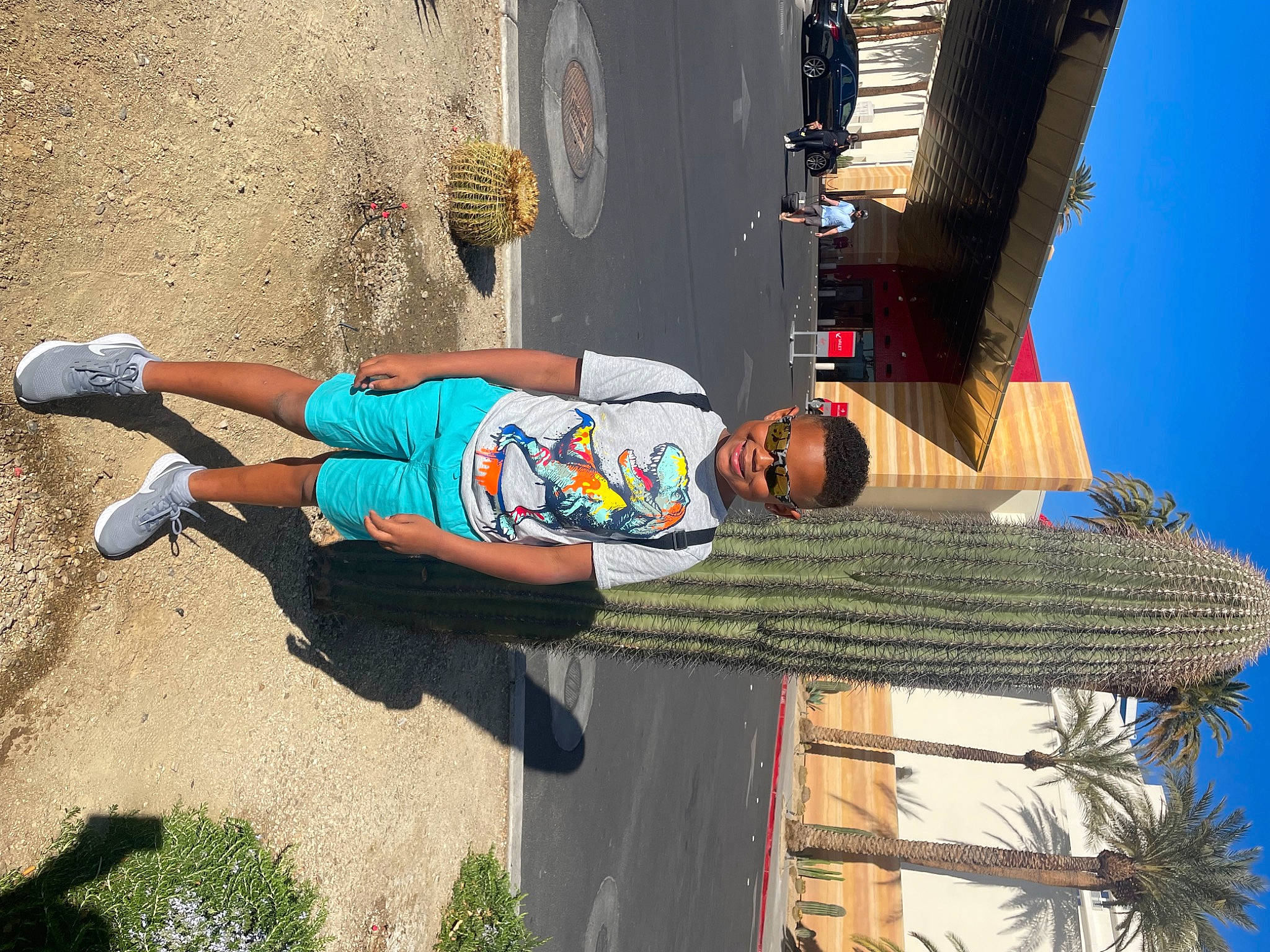 Michael joined the competition — help win amazing prizes! blue, concrete, electric_blue, fun, hat, human_leg, joy, leisure, person, plant, shorts, sidewalk, sky, street, street_fashion, t_shirt, thigh, tire, travel, vacation