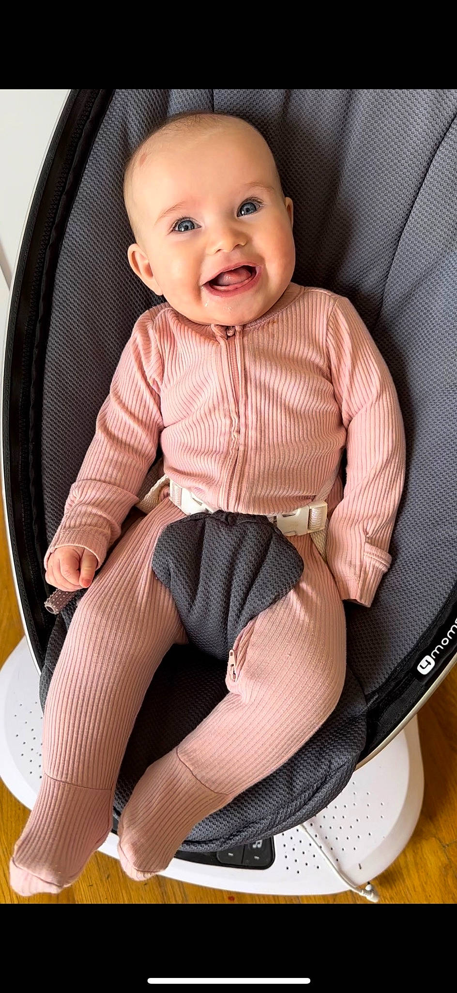 Wrenlee is registered to the contest to win money with this photo: arm, baby, baby_toddler_clothing, car_seat, chair, comfort, face, human_leg, knee, leg, pattern, person, seat_belt, shorts, sitting, skin, sleeve, smile, sock, thigh