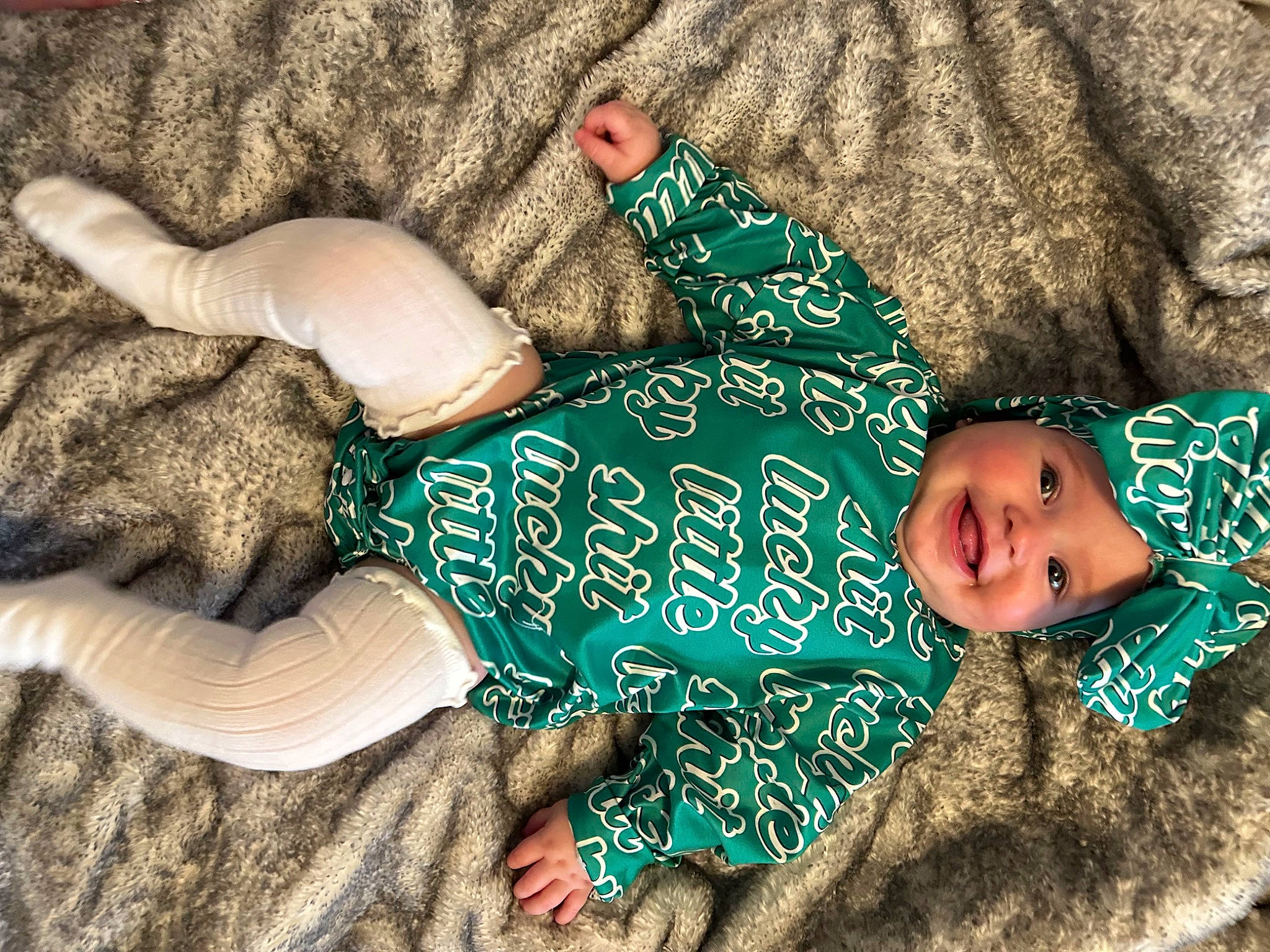 Wrenlee is registered to the contest to win money with this photo: child, comfort, fawn, fun, grass, happy, headwear, human_leg, joy, linens, mammal, pattern, people, person, skin, sleeve, smile, textile, thigh, toddler