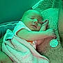 Evelyn is registered to the contest to win money with this photo: baby, sleeping, blanket, person, tattoo, necklace, hand, skin, face, infant, rest, comfort, closeup, indoors, cozy, pink, soft, cute, parent, bond