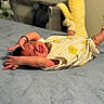 Ethan is registered to the contest to win money with this photo: newborn, baby, infant, stretching, onesie, bed, blanket, sock, yellow, cute, sleepwear, lying_down, indoors, soft, child, person, human, portrait, expression, rest