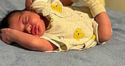 Ethan joined the competition — help win amazing prizes! baby, newborn, sleeping, onesie, yellow_bear_prints, socks, blanket, bed, infant, cozy, cute, peaceful, soft, resting, portrait, indoors, child, tiny, relaxed, sleep