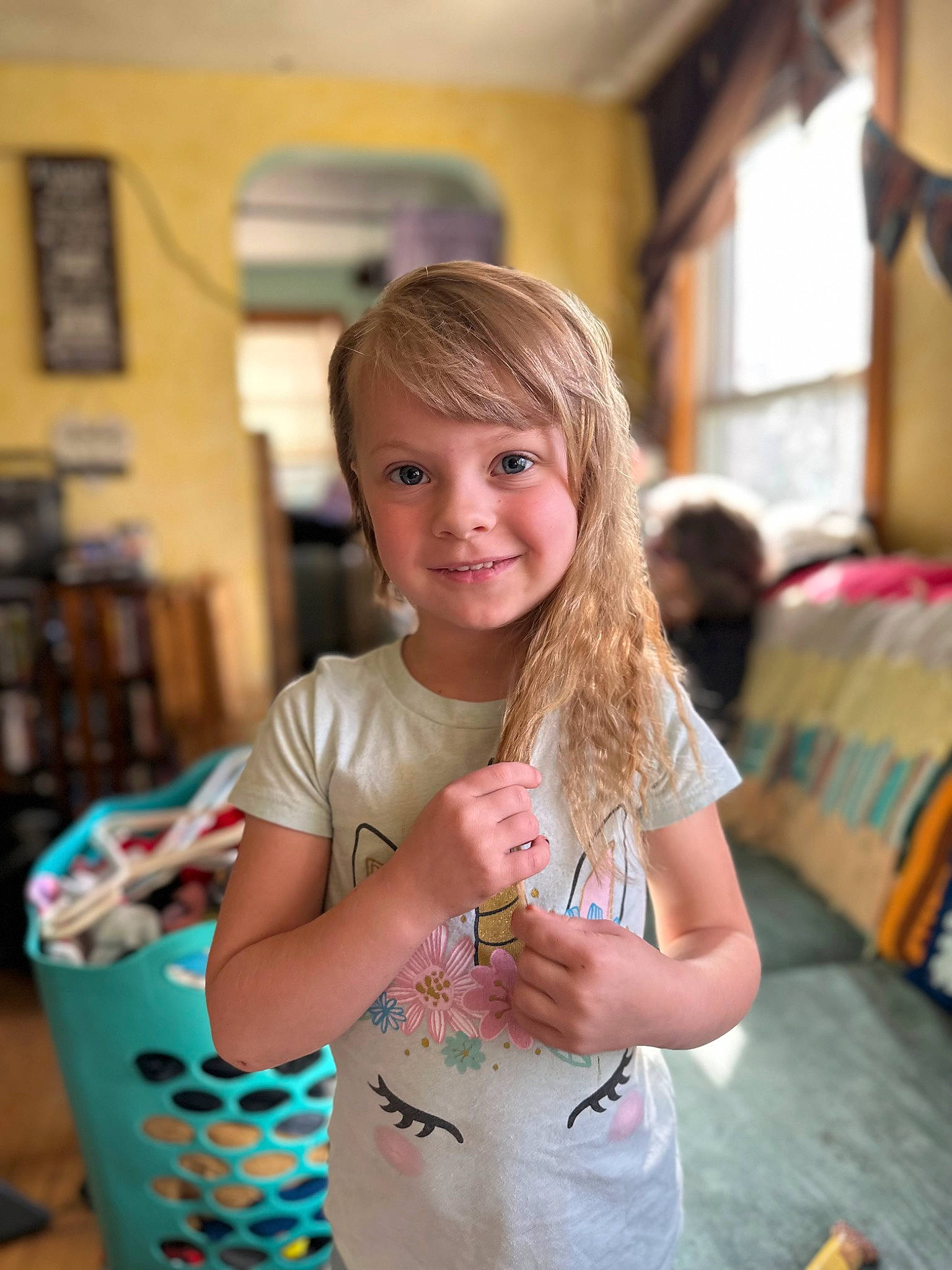 Bella is registered to the contest to win money with this photo: arm, chair, child, cup, event, fun, hairstyle, happy, joy, leisure, necklace, party, pattern, person, picture_frame, play, shelf, sitting, summer, t_shirt