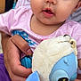 adorable, baby, child, closeup, cute, expression, eyes, face, focus, hand, holding, indoor, infant, person, pink_clothing, plush_toy, portrait, soft_toy, stuffed_animal, young_child