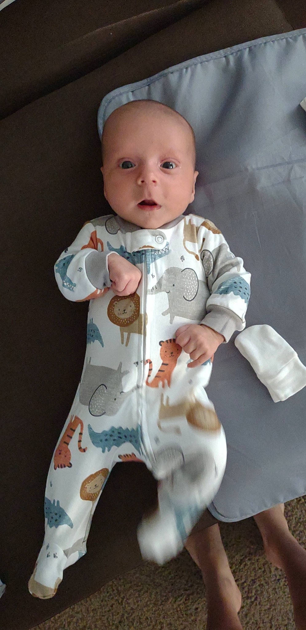 Exavier is registered to the contest to win money with this photo: baby, baby_toddler_clothing, cheek, chin, collar, comfort, eye, face, gesture, hand, head, infant_bodysuit, leg, neck, one_piece_garment, pattern, person, skin, sleeve, thumb