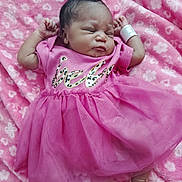 Sevyn joined the competition — help win amazing prizes! baby, infant, sleeping, pink_dress, blanket, floral_pattern, newborn, peaceful, soft_texture, arms_up, foot, skin, cute, child, indoors, closeup, fabric, clothing, resting, portrait