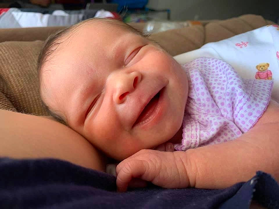 Layla is registered to the contest to win money with this photo: baby, baby_toddler_clothing, bedtime, cheek, child, comfort, eye, eyebrow, eyelash, finger, happy, iris, lip, mouth, nose, person, skin, smile, thumb, toddler