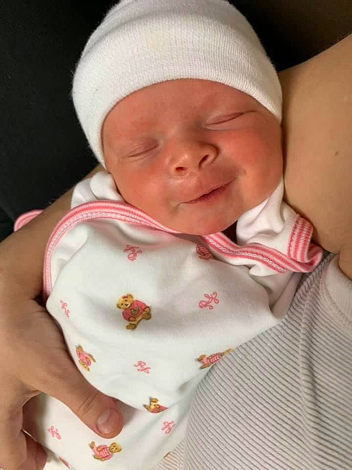 Layla is registered to the contest to win money with this photo: baby, baby_toddler_clothing, cap, cheek, child, collar, comfort, face, finger, hat, headgear, headwear, human_body, linens, lip, mouth, person, pink, skin, sleeve