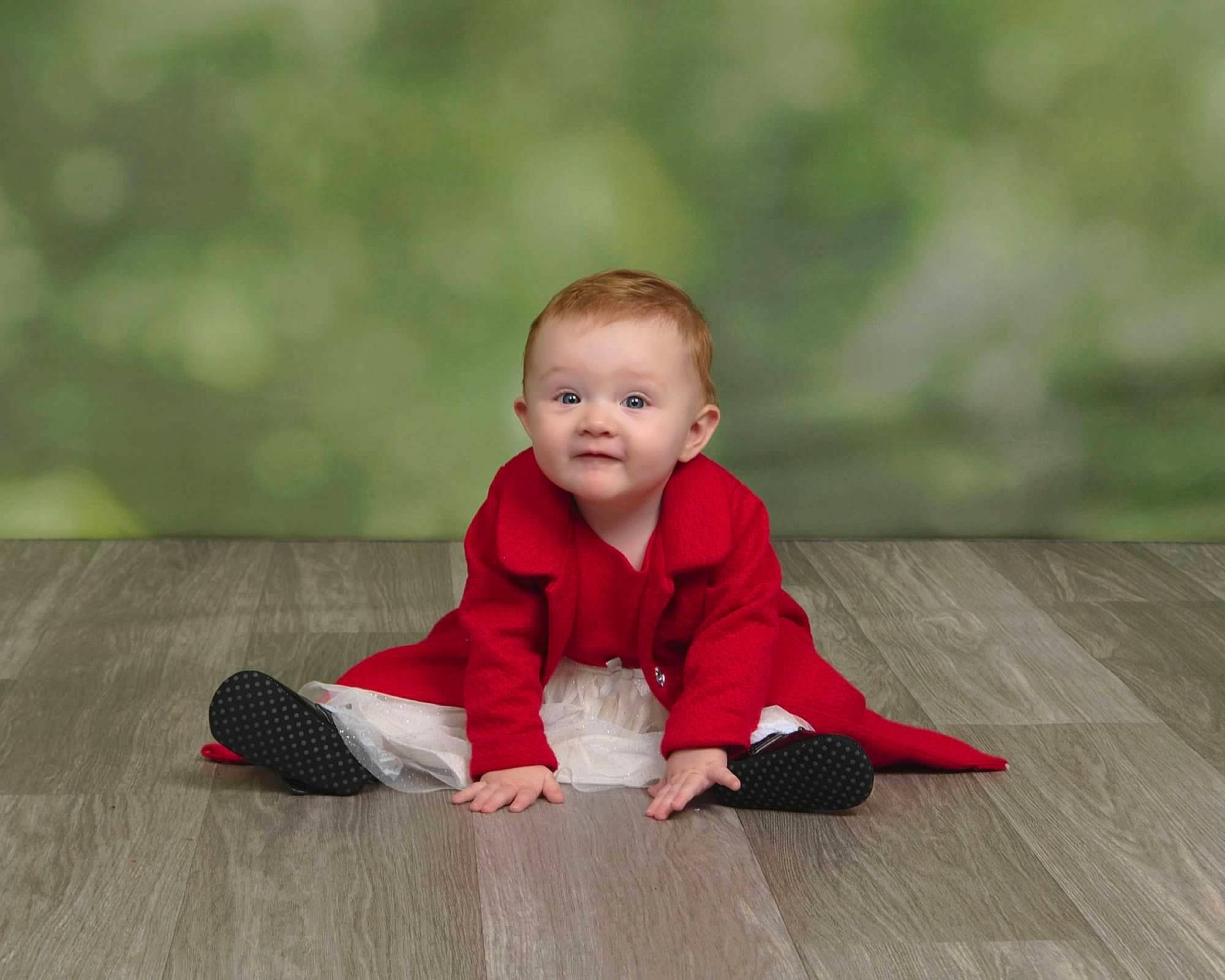 Evelyn is registered to the contest to win money with this photo: baby, baby_crawling, baby_toddler_clothing, cheek, face, flash_photography, floor, flooring, grass, happy, hardwood, people_in_nature, person, plank, sitting, sleeve, smile, toddler, wood, wood_flooring