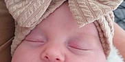 Ambre participe au concours pour gagner de l'argent avec cette photo : baby, beanie, blanket, bonnet, cap, clothing, couch, cushion, face, furniture, hat, head, newborn, person, photography, portrait, quilt, sleeping, towel, turban