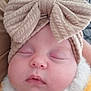 baby, beanie, blanket, bonnet, cap, clothing, couch, cushion, face, furniture, hat, head, newborn, person, photography, portrait, quilt, sleeping, towel, turban