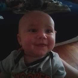 Austin is registered to the contest to win money with this photo: baby, baby_toddler_clothing, cheek, child, cloud, comfort, darkness, ear, fun, happy, jaw, joy, laugh, mouth, nose, person, portrait_photography, sitting, smile, toddler