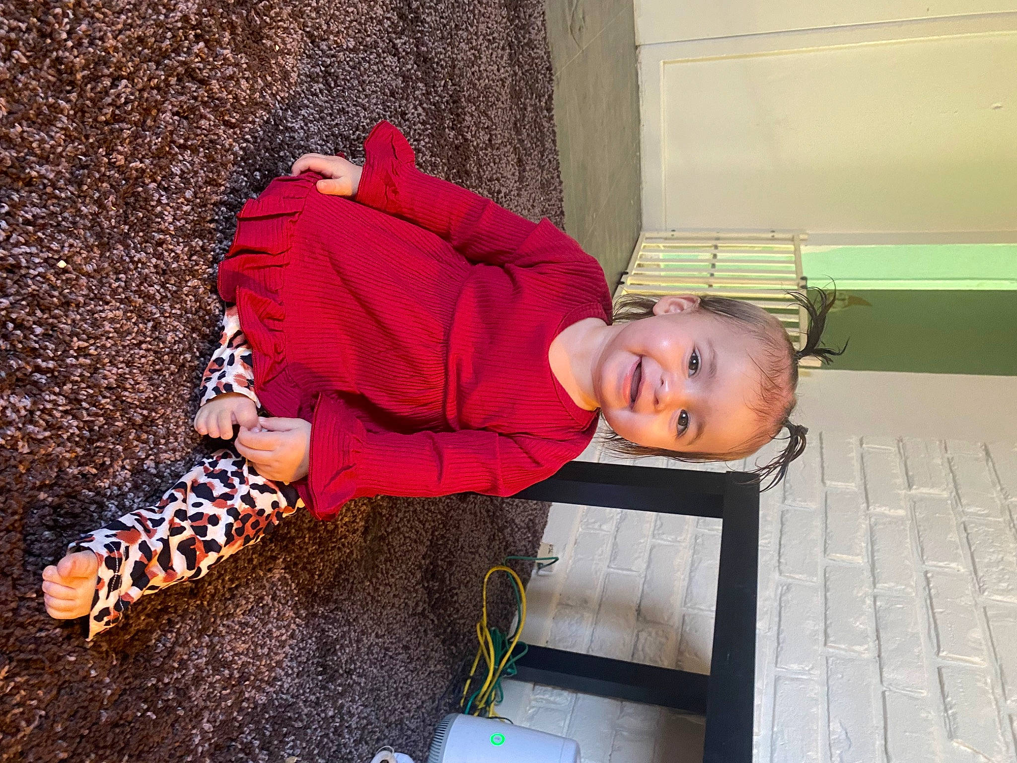 Amyah is registered to the contest to win money with this photo: baby_toddler_clothing, carmine, child, concrete, flooring, fun, hat, human_leg, joy, leisure, person, sitting, smile, toddler, tree, wood